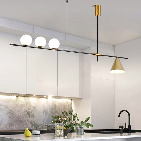 Видовжена люстра в чорному корпусі із латунними деталями