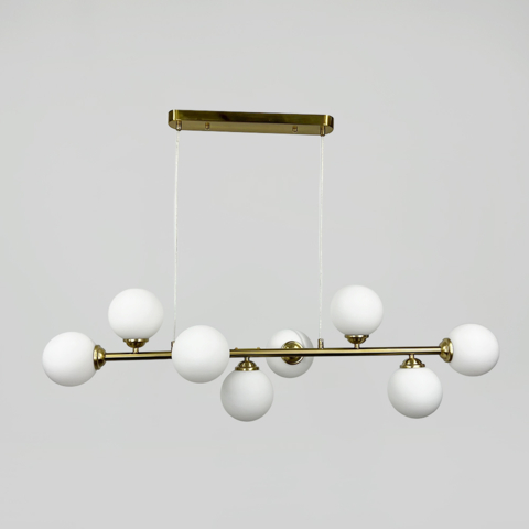 Видовжена латунна люстра на 8 білих плафонів 100х30 см